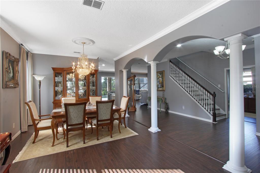 5536 Ansley Way Mount Dora, FL 32757 - Photo 28 of 49 a view of a dining room with furniture and wooden floor