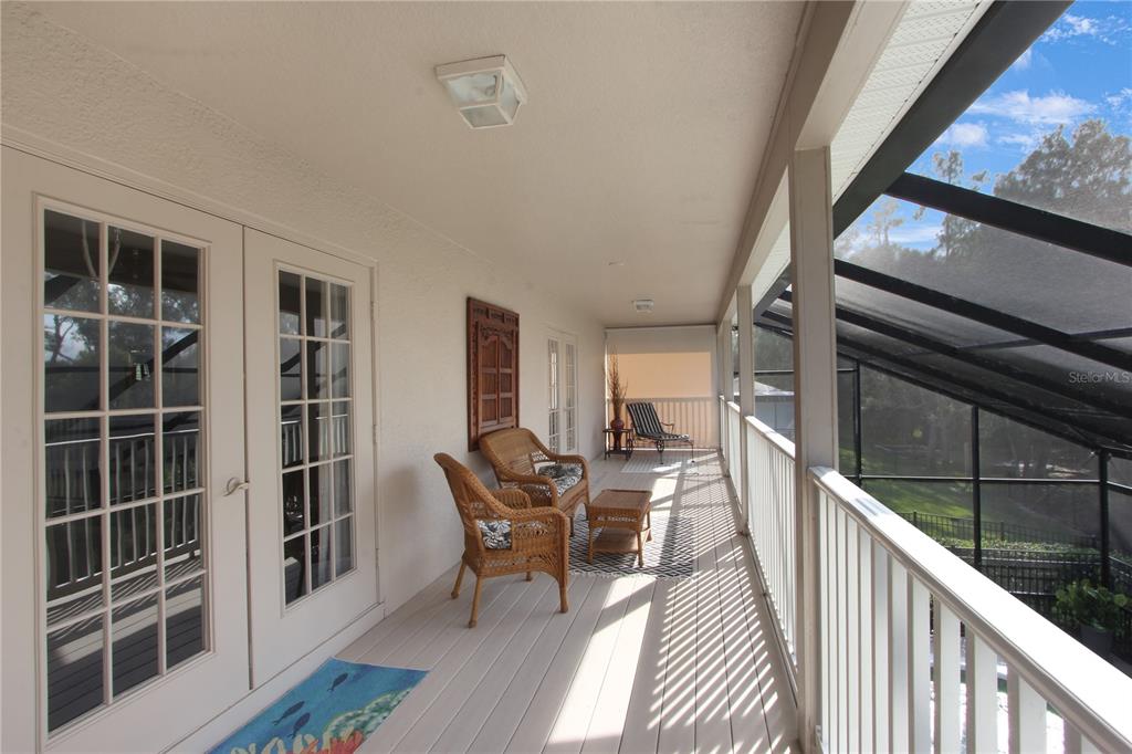 5536 Ansley Way Mount Dora, FL 32757 - Photo 35 of 49 a view of a porch with furniture and wooden floor