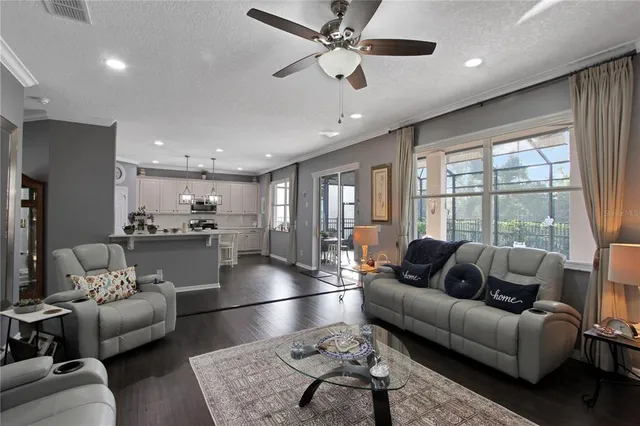 a kitchen with a sink stainless steel appliances and white cabinets