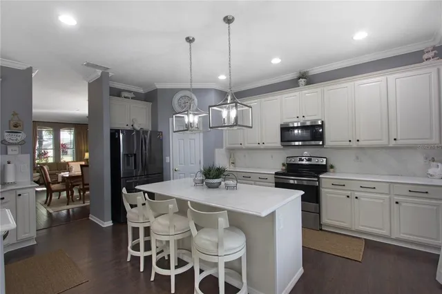 a bedroom with a bed and a potted plant