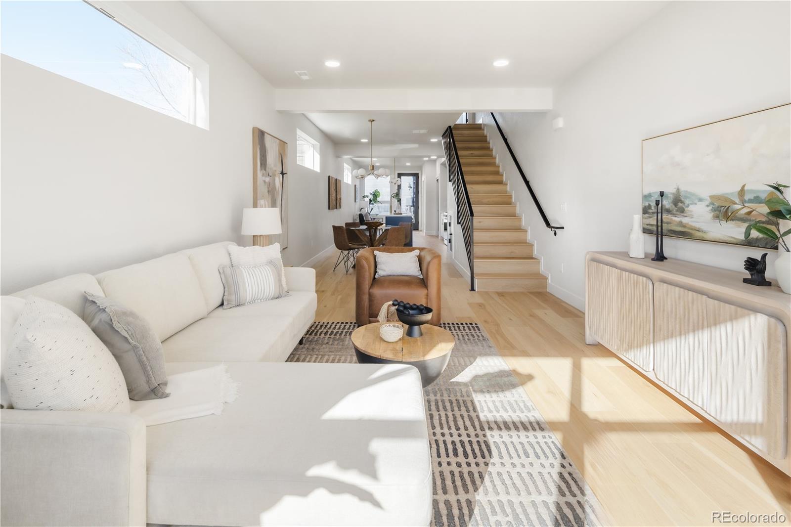 1343 Perry Street Denver, CO 80204 - Photo 11 of 37 a living room with furniture and wooden floor