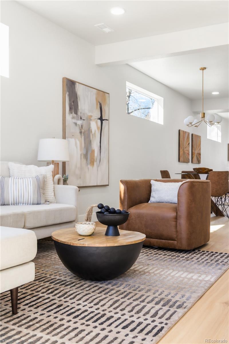 1343 Perry Street Denver, CO 80204 - Photo 13 of 37 a living room with furniture and a lamp