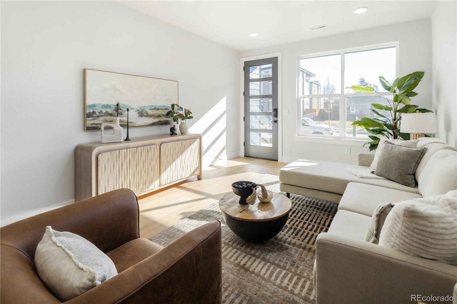 1343 Perry Street Denver, CO 80204 - Photo 14 of 37 a living room with furniture and a potted plant