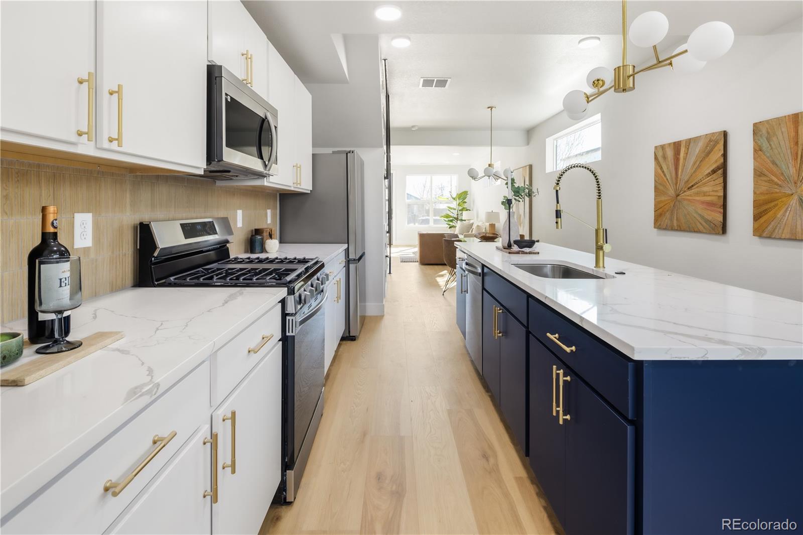 1343 Perry Street Denver, CO 80204 - Photo 17 of 37 a kitchen with stainless steel appliances granite countertop a sink stove and refrigerator