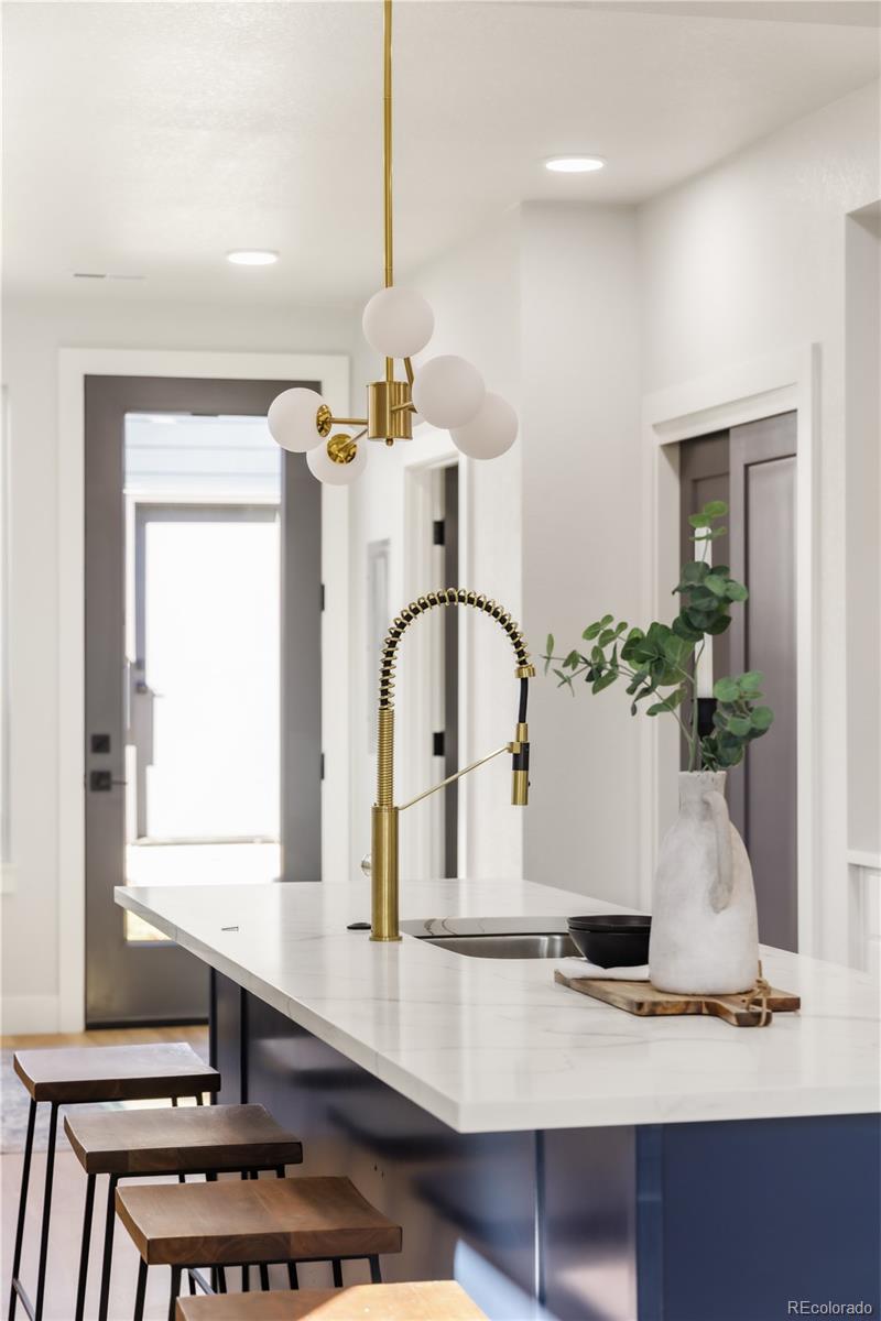 1343 Perry Street Denver, CO 80204 - Photo 18 of 37 a view of living room with furniture and potted plant