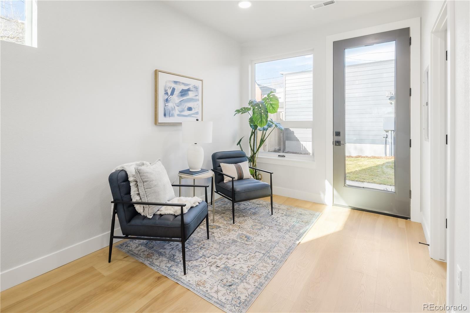1343 Perry Street Denver, CO 80204 - Photo 20 of 37 a living room with furniture and a window