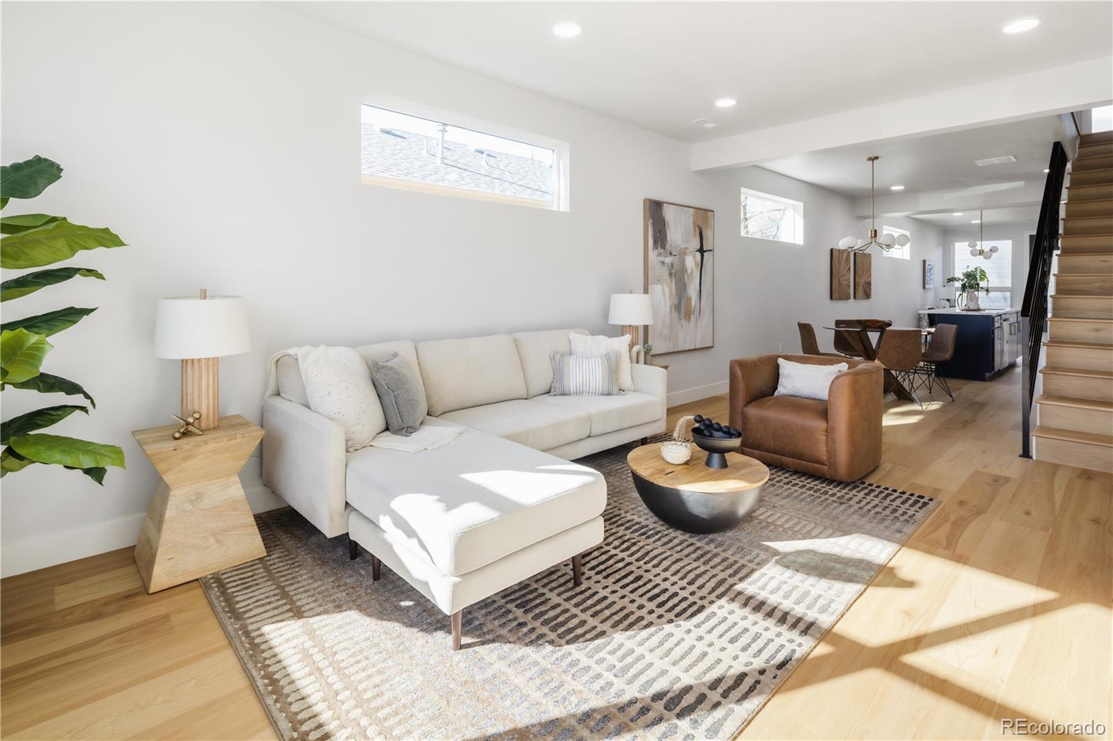 1343 Perry Street Denver, CO 80204 - Photo 2 of 37 a living room with furniture and wooden floor