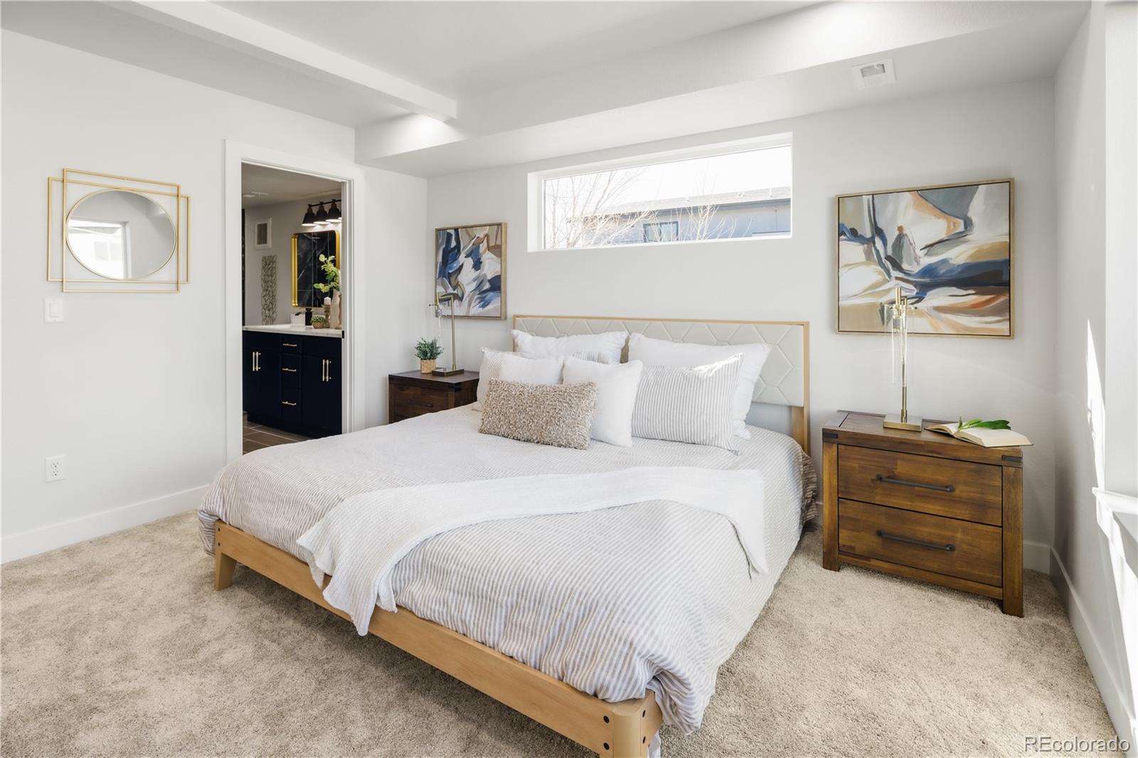 1343 Perry Street Denver, CO 80204 - Photo 22 of 37 a bedroom with a bed and a painting on the wall