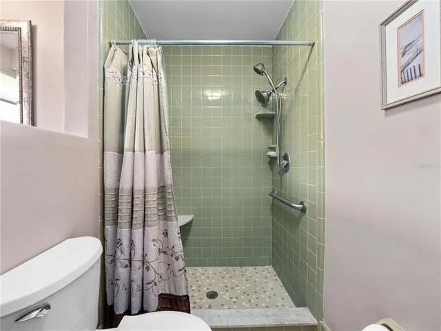 a bathroom with a double vanity sink mirror and