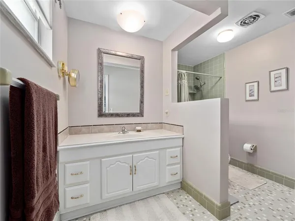 a bathroom with a shower and toilet