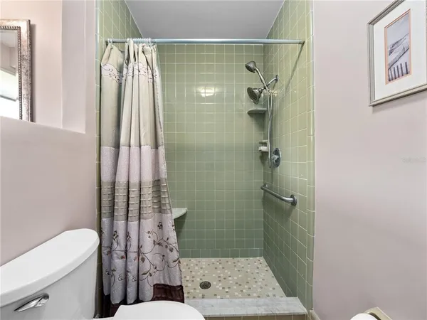 a bathroom with a double vanity sink mirror and