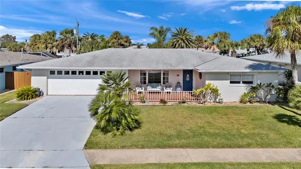 an aerial view of a house with outdoor space