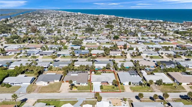 a view of swimming pool with a patio and a yard
