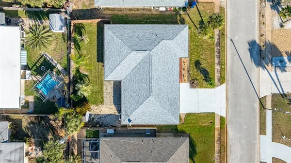 a living room with stainless steel appliances kitchen island a table and chairs