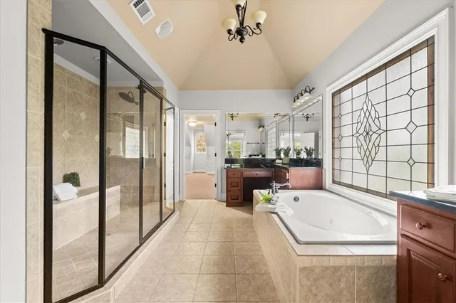 a kitchen with a refrigerator a sink and cabinets