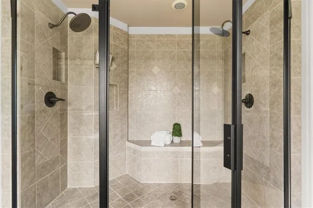 a bathroom with a bathtub and shower