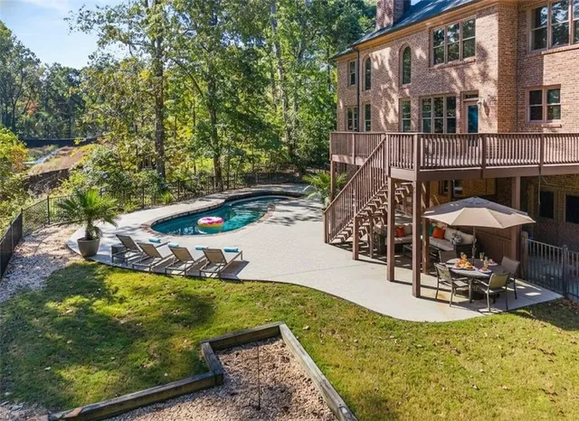 a view of a swimming pool with a patio