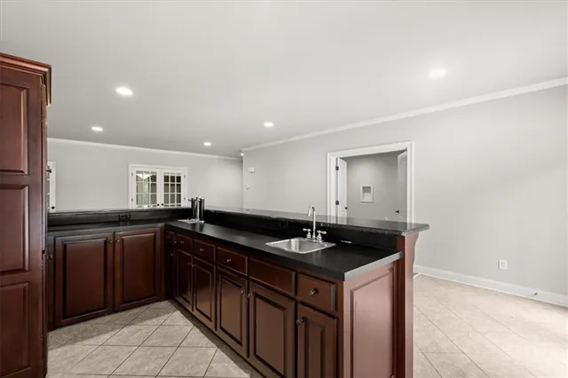 a kitchen with a sink and cabinets
