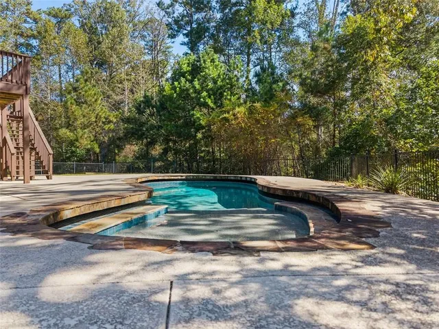 a view of a yard with an outdoor seating