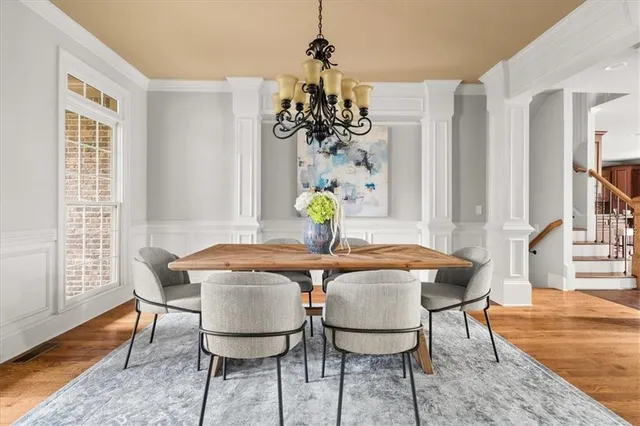 a view of a dining room with furniture window and wooden floor
