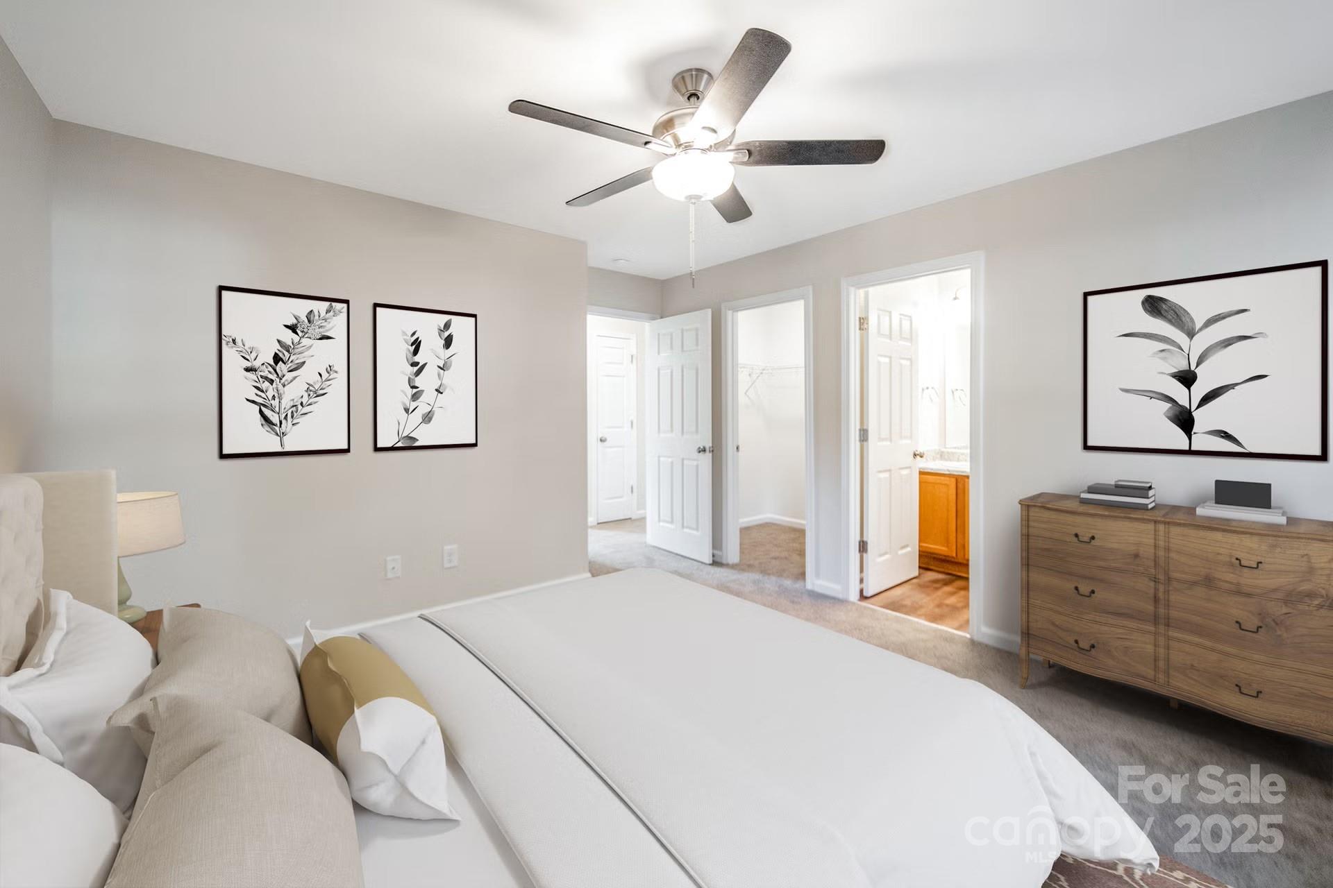 152 Moore's Lake Road, Unit 1 Wadesboro, NC 28170 - Photo 5 of 7 a bedroom with a large bed and a chandelier