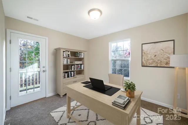 a living room with furniture and window