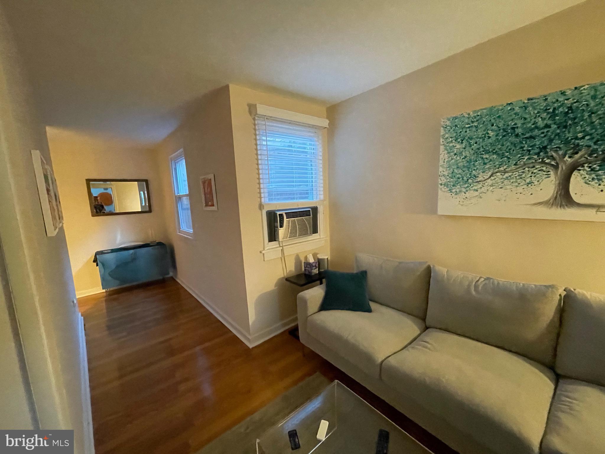 1155 South 10th Street, Unit 2 Philadelphia, PA 19147 - Photo 2 of 13 a living room with furniture and a couch