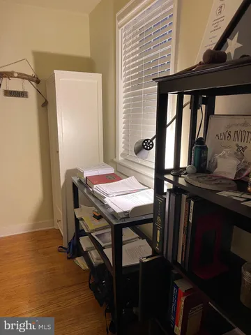 a kitchen with a refrigerator and a stove top oven