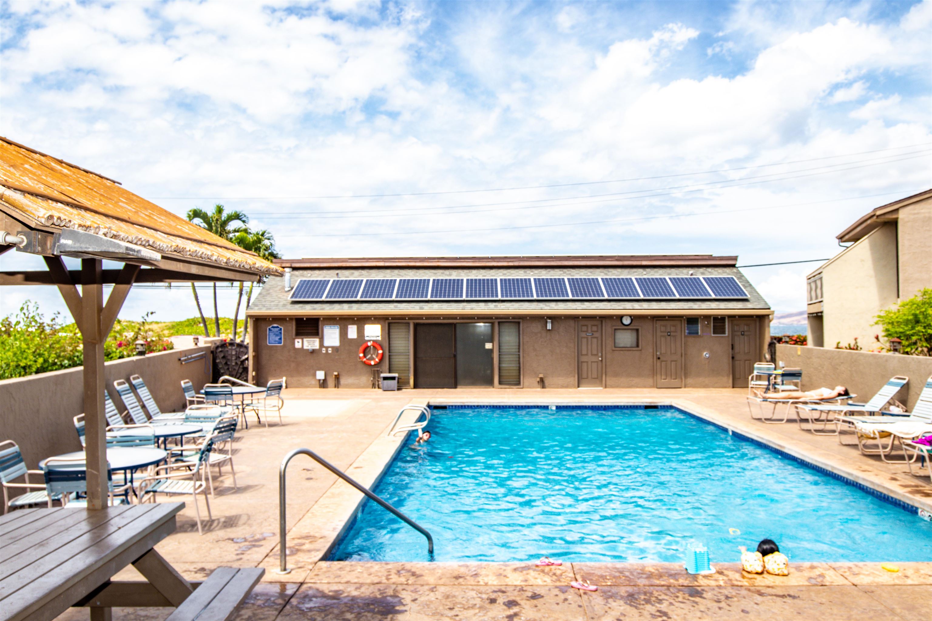 483 South Kihei Road, Unit 217 Kihei, HI 96753 - Photo 13 of 22 a view of a swimming pool with an outdoor seating