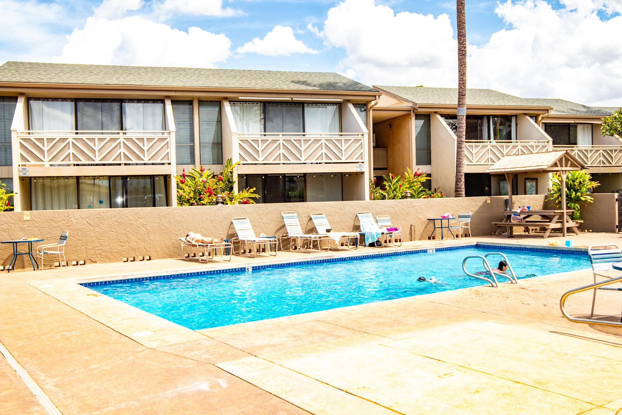 483 South Kihei Road, Unit 217 Kihei, HI 96753 - Photo 14 of 22 a front view of a house with swimming pool and a yard