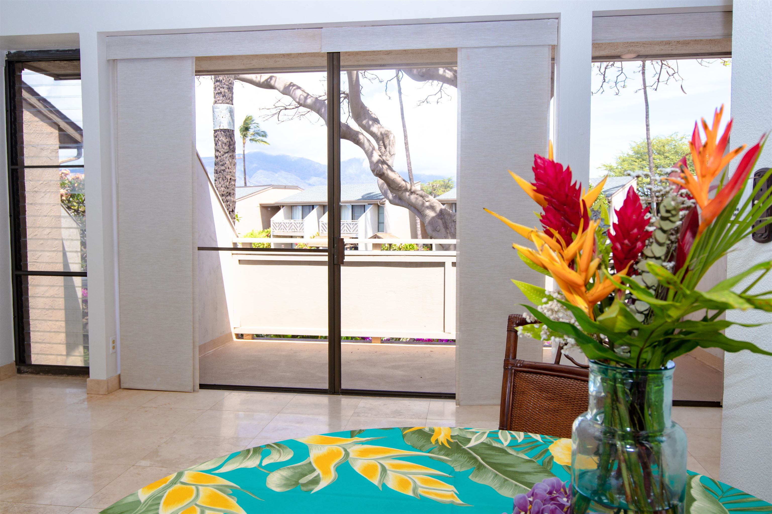 483 South Kihei Road, Unit 217 Kihei, HI 96753 - Photo 2 of 22 a flower pot on a table next to a window