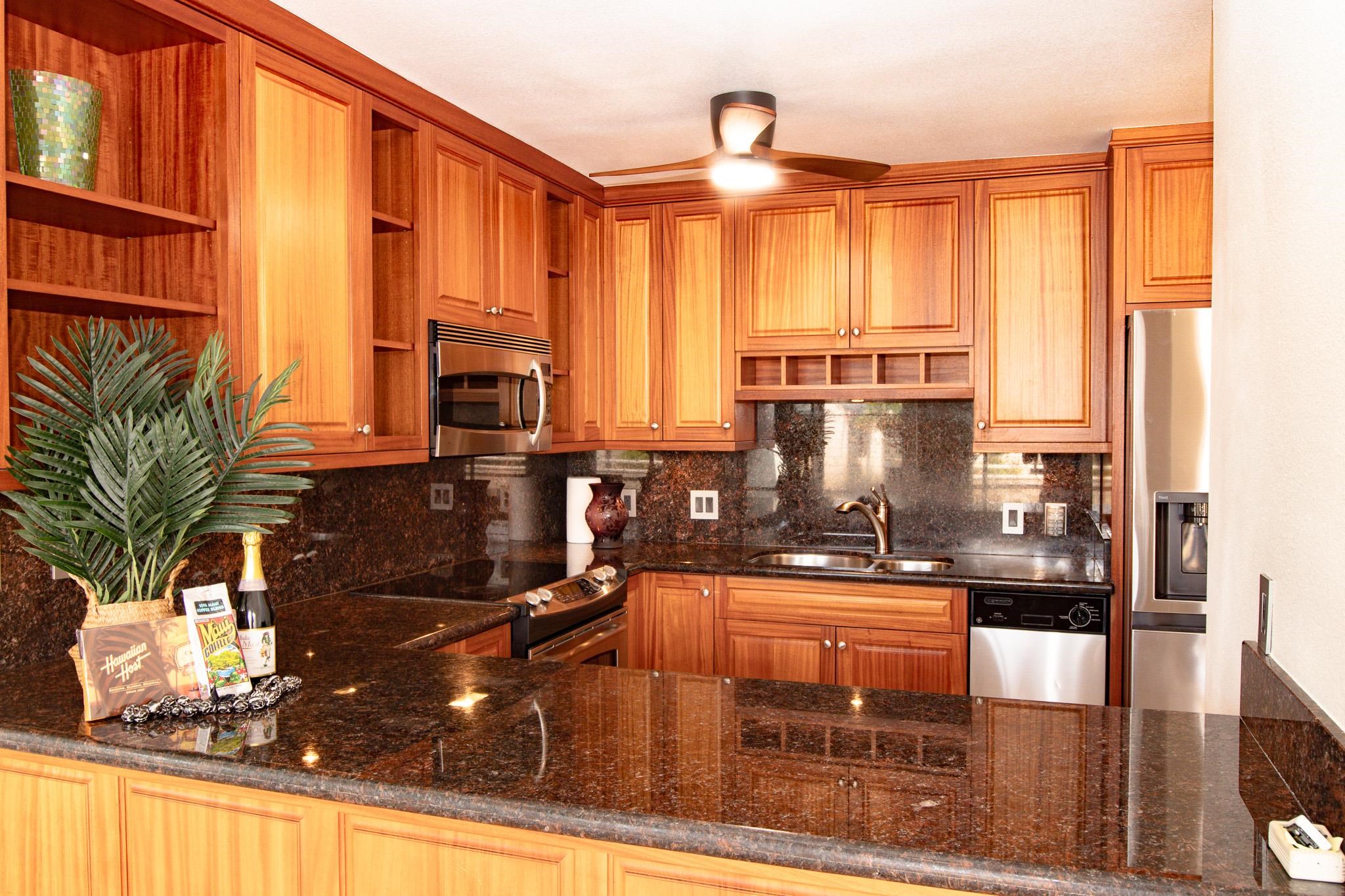 483 South Kihei Road, Unit 217 Kihei, HI 96753 - Photo 7 of 22 a kitchen with large windows and furniture