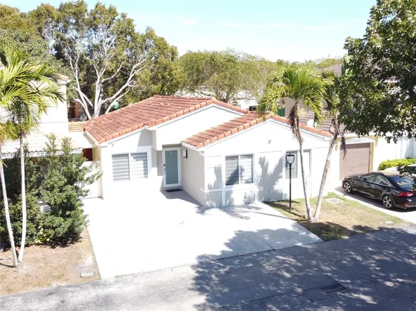 a front view of a house with a garage