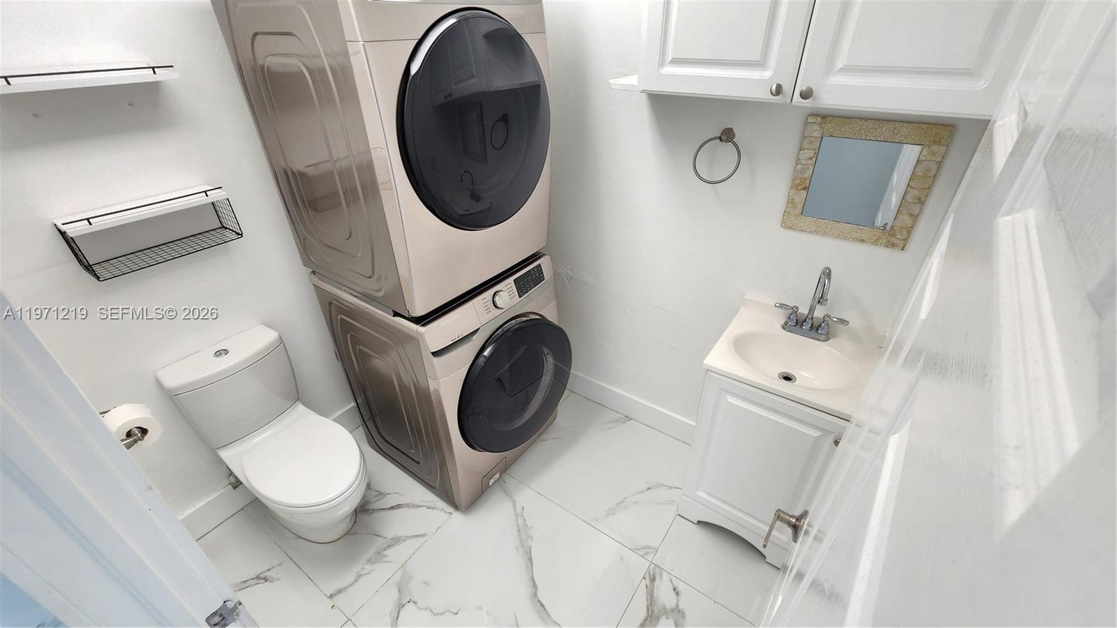 16515 Southwest 97th Street Miami, FL 33196 - Photo 12 of 38 a bathroom with a toilet and a sink