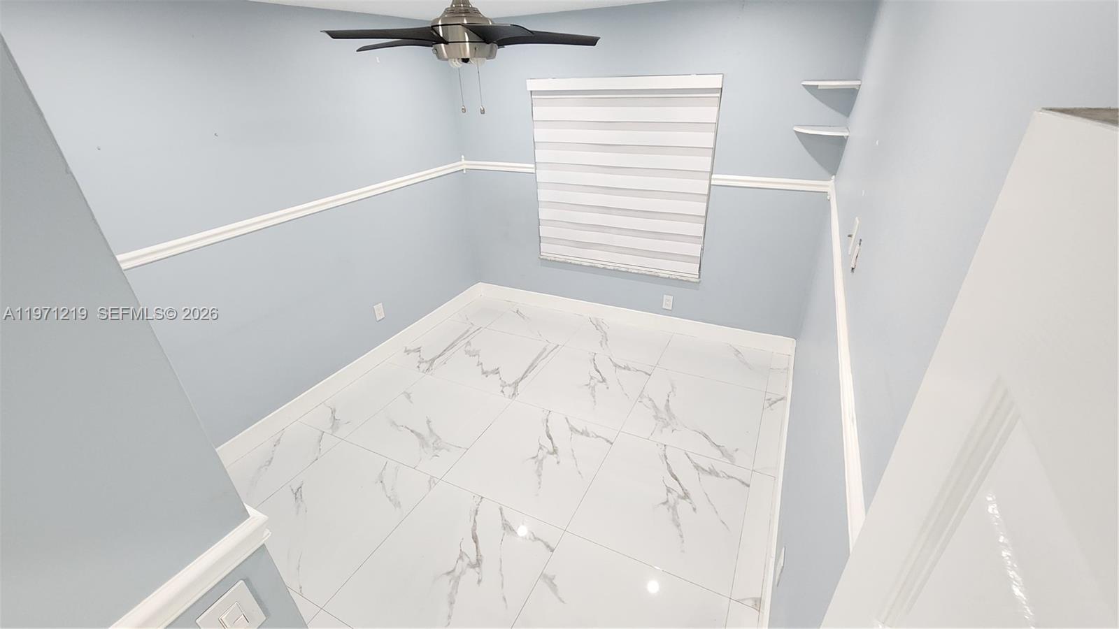 16515 Southwest 97th Street Miami, FL 33196 - Photo 13 of 38 a view of a bedroom with a window