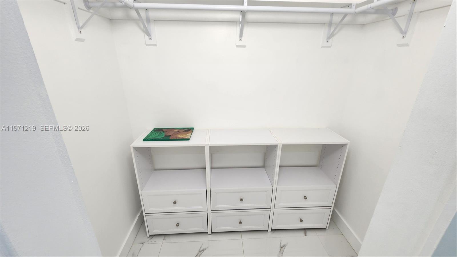 16515 Southwest 97th Street Miami, FL 33196 - Photo 24 of 38 a view of an empty walk in closet