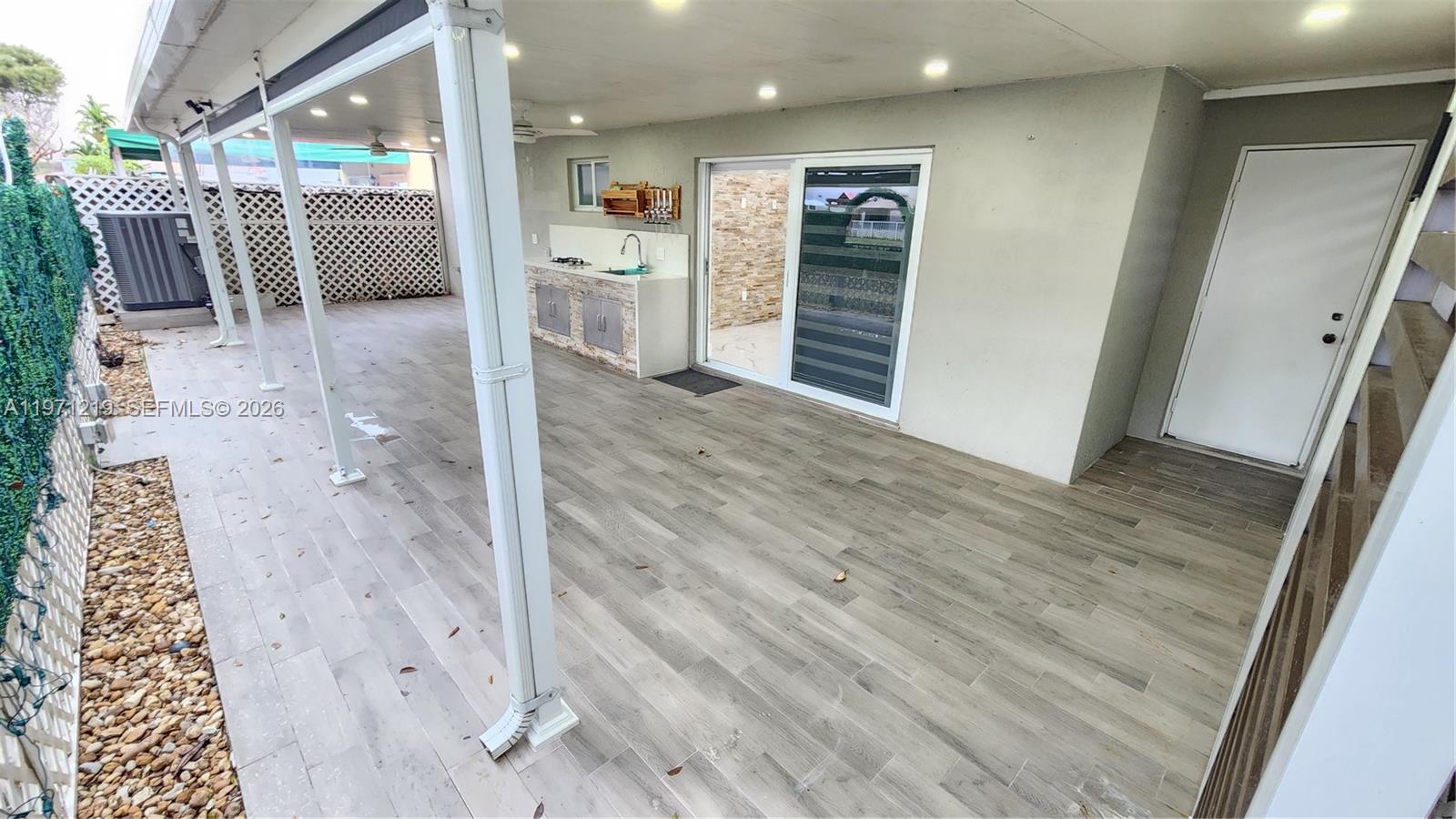 16515 Southwest 97th Street Miami, FL 33196 - Photo 27 of 38 a view of hallway with wooden floor