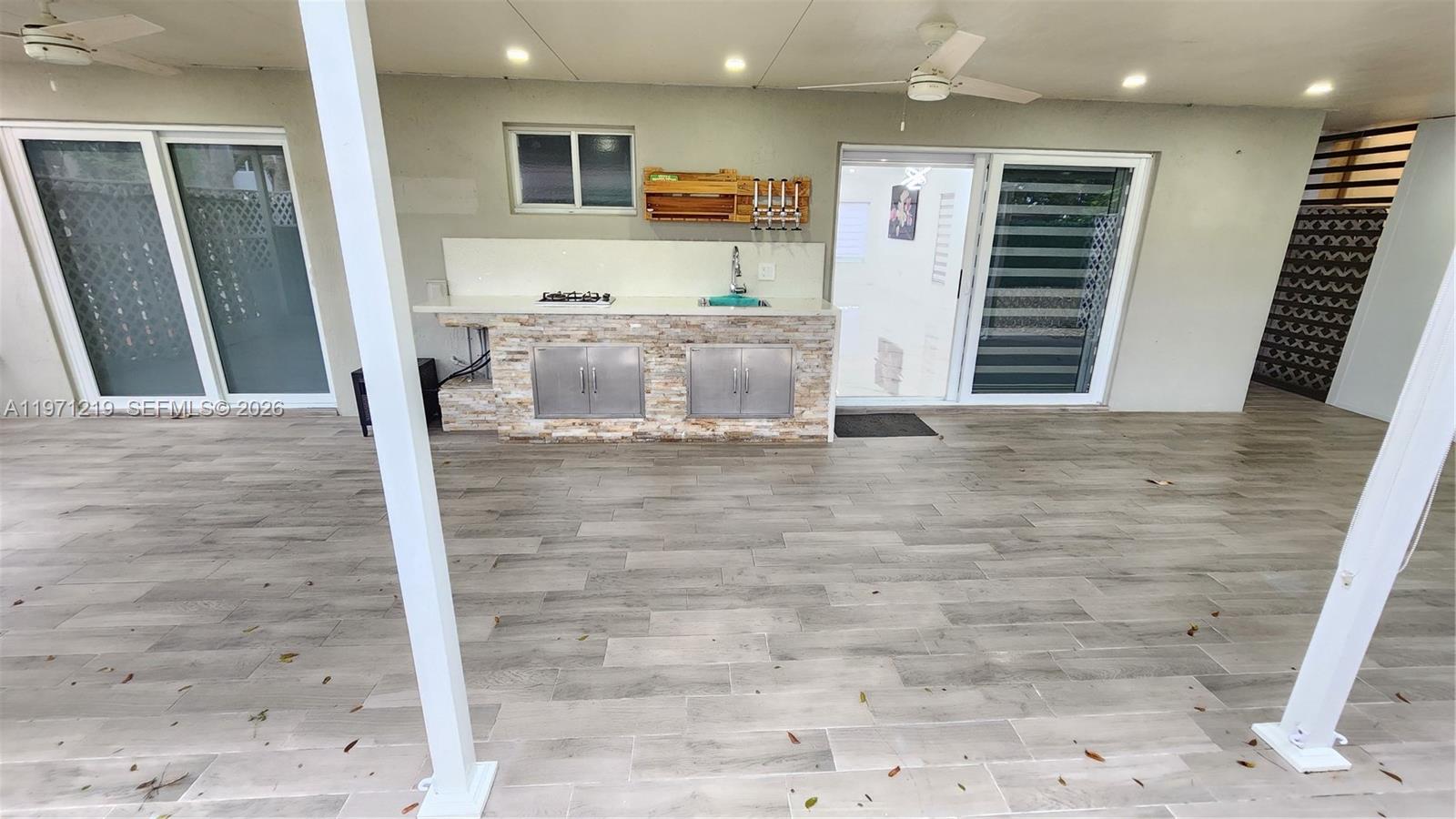 16515 Southwest 97th Street Miami, FL 33196 - Photo 28 of 38 a view of a hallway with bathroom and wooden floor