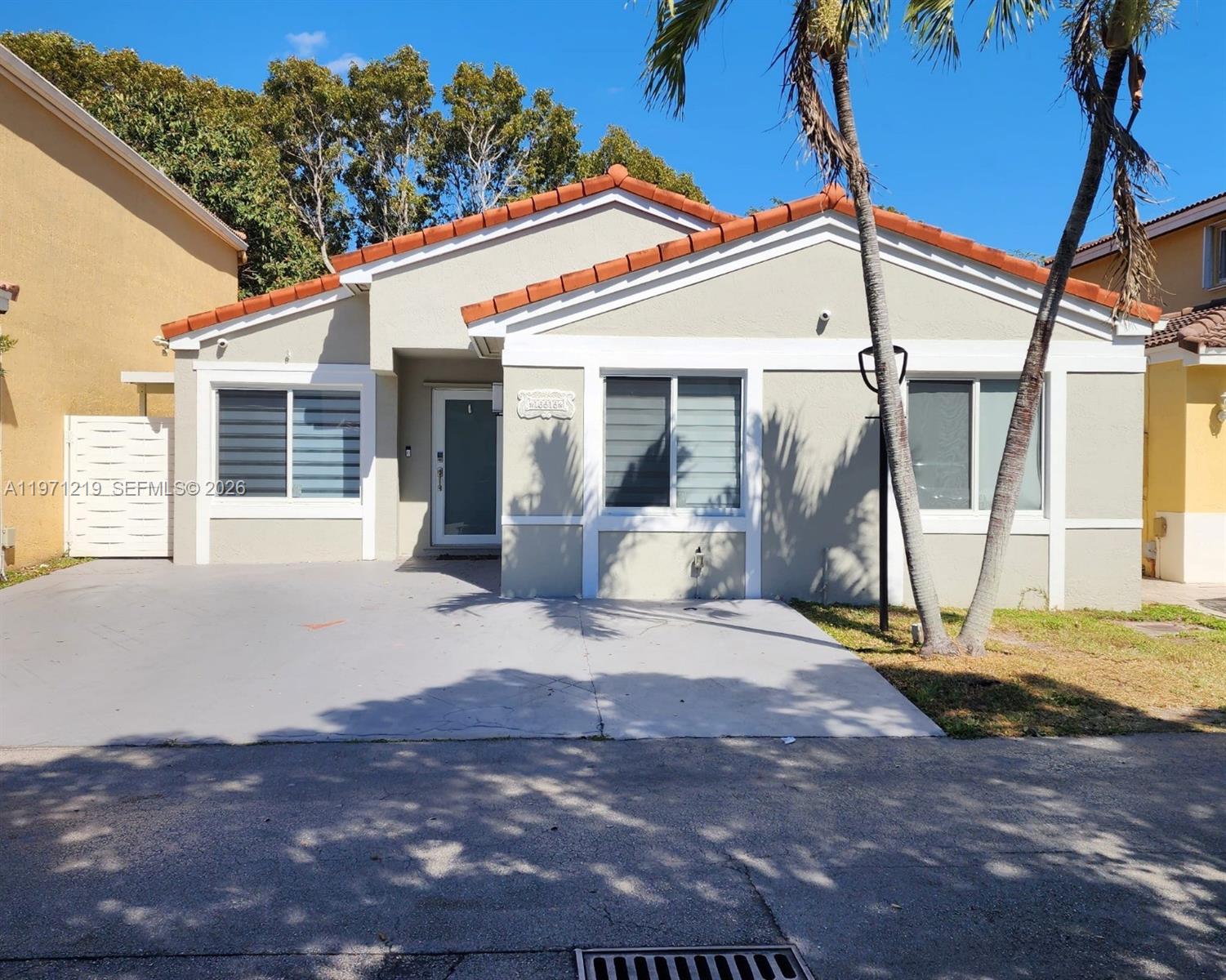 16515 Southwest 97th Street Miami, FL 33196 - Photo 3 of 38 a view of a house with backyard and sitting area