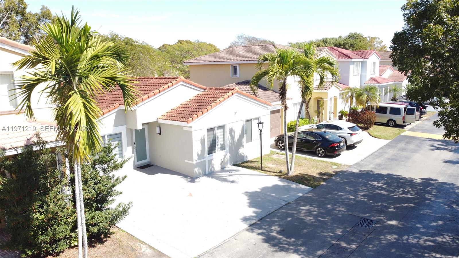 16515 Southwest 97th Street Miami, FL 33196 - Photo 5 of 38 a view of a street with houses