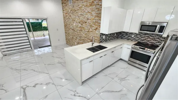 a bathroom with a shower and a toilet