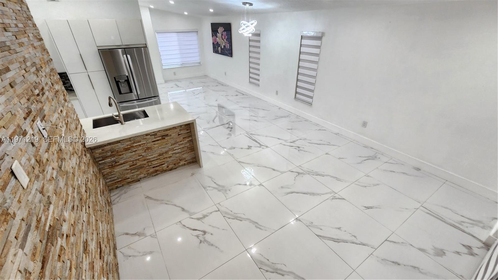 16515 Southwest 97th Street Miami, FL 33196 - Photo 9 of 38 a bathroom with a sink a vanity and mirror