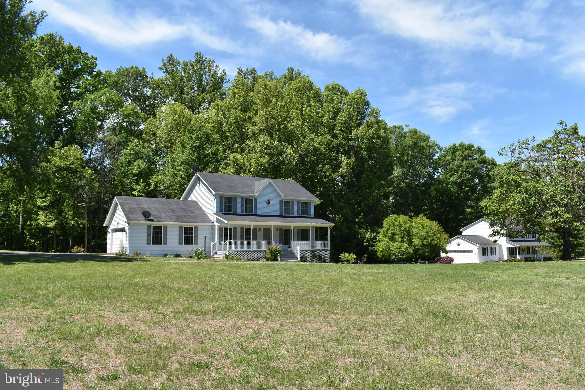 10958 Mountain Run Lake Road Culpeper, VA 22701 - Photo 30 of 31 a front view of a house with garden