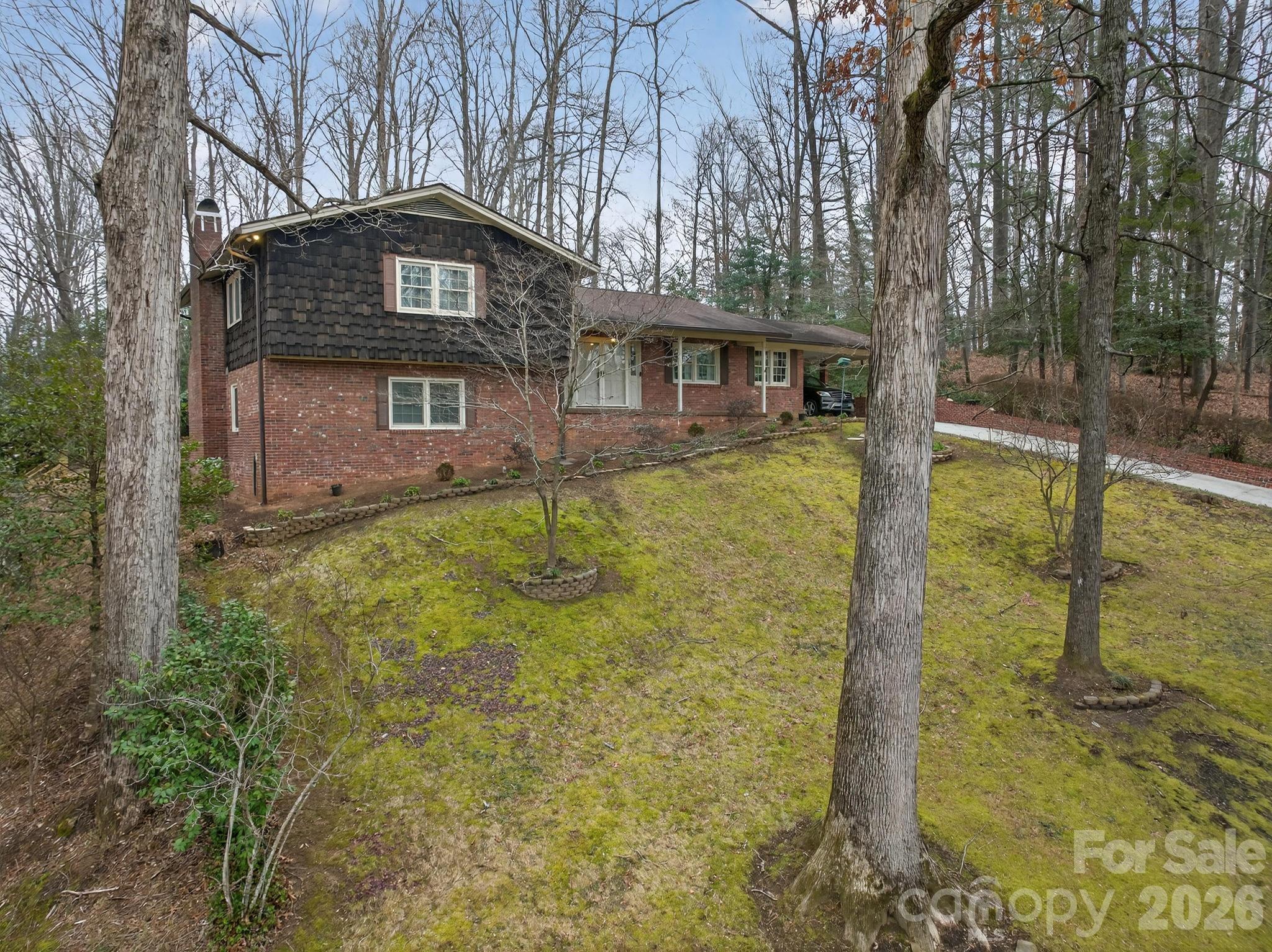 408 Spring Street Northwest Lenoir, NC 28645 - Photo 1 of 47 a front view of a house with a yard