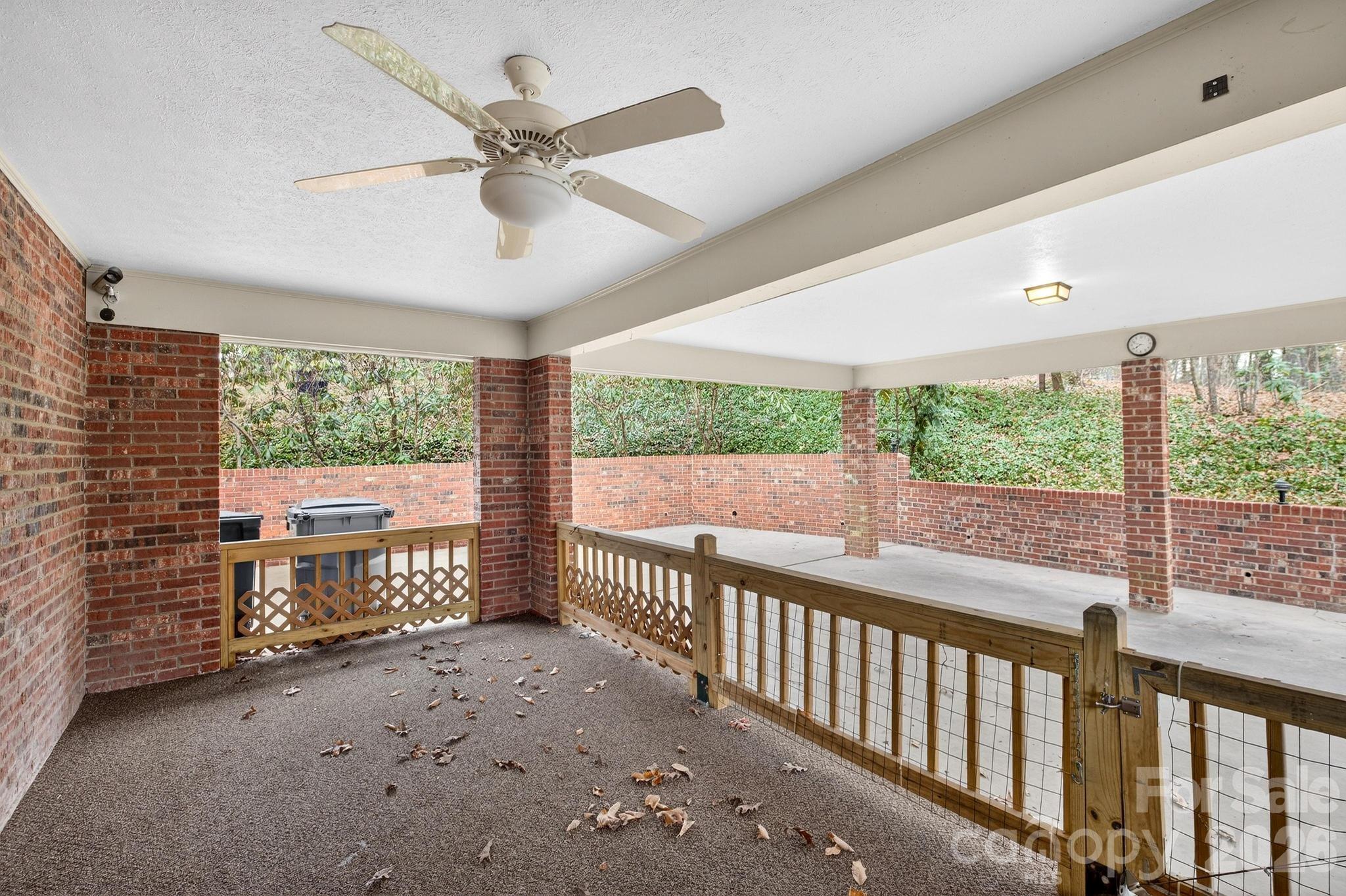408 Spring Street Northwest Lenoir, NC 28645 - Photo 13 of 47 a view of a porch with wooden floor and outdoor space
