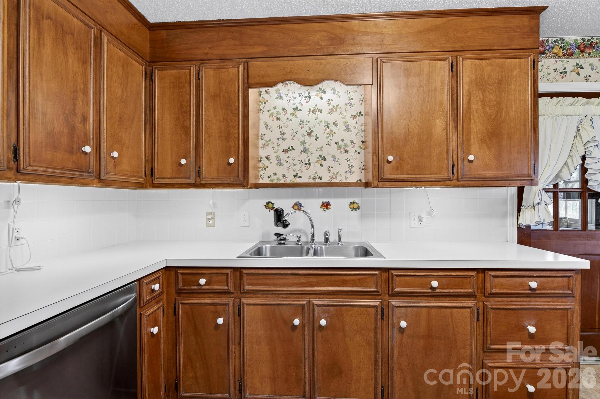 408 Spring Street Northwest Lenoir, NC 28645 - Photo 15 of 47 a kitchen with a sink and cabinets