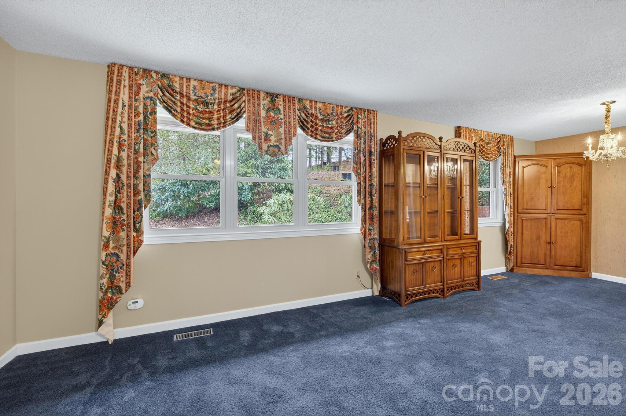 408 Spring Street Northwest Lenoir, NC 28645 - Photo 19 of 47 a view of an empty room with air conditioner and a window
