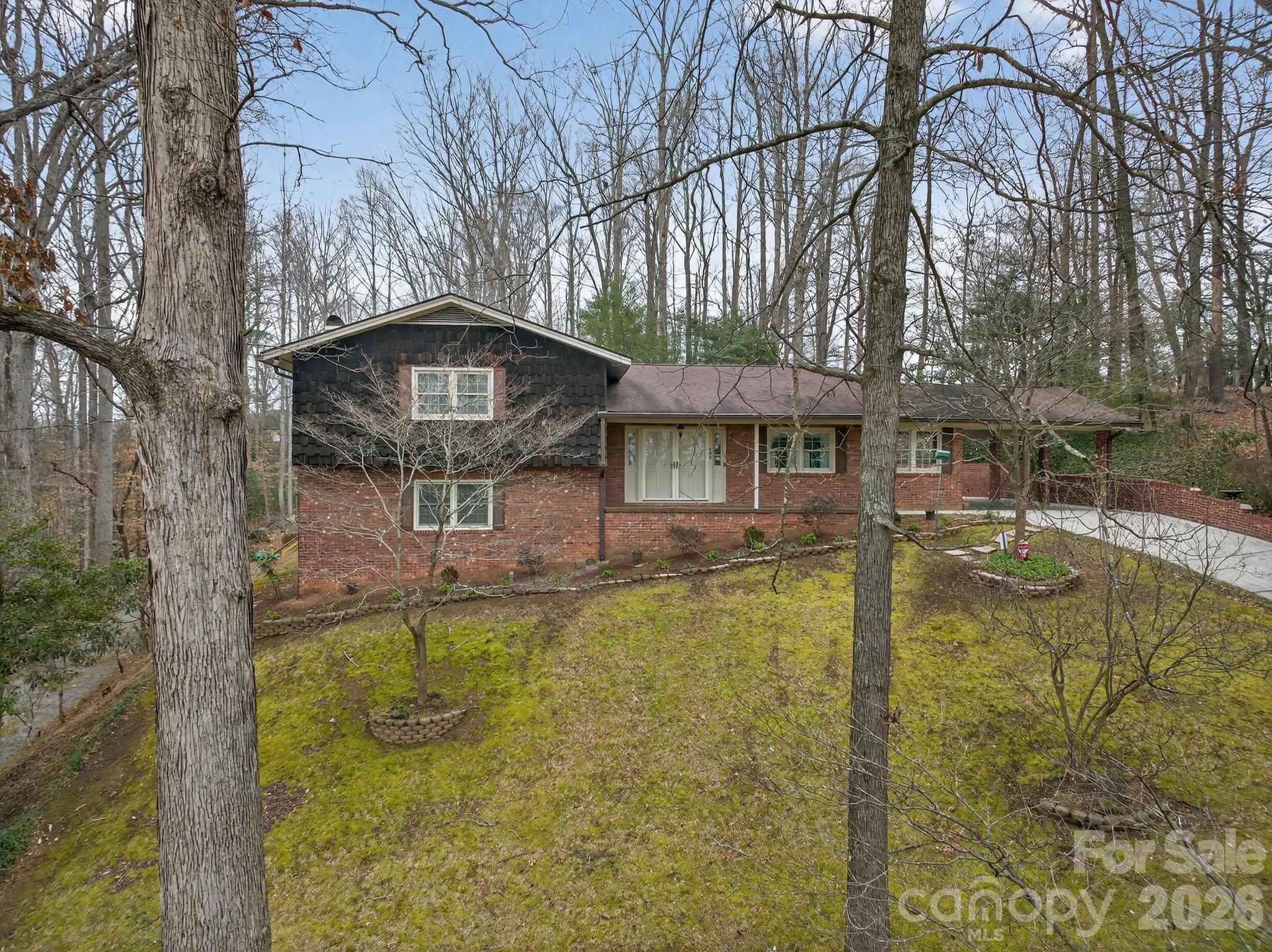408 Spring Street Northwest Lenoir, NC 28645 - Photo 2 of 47 a view of a swimming pool with a patio