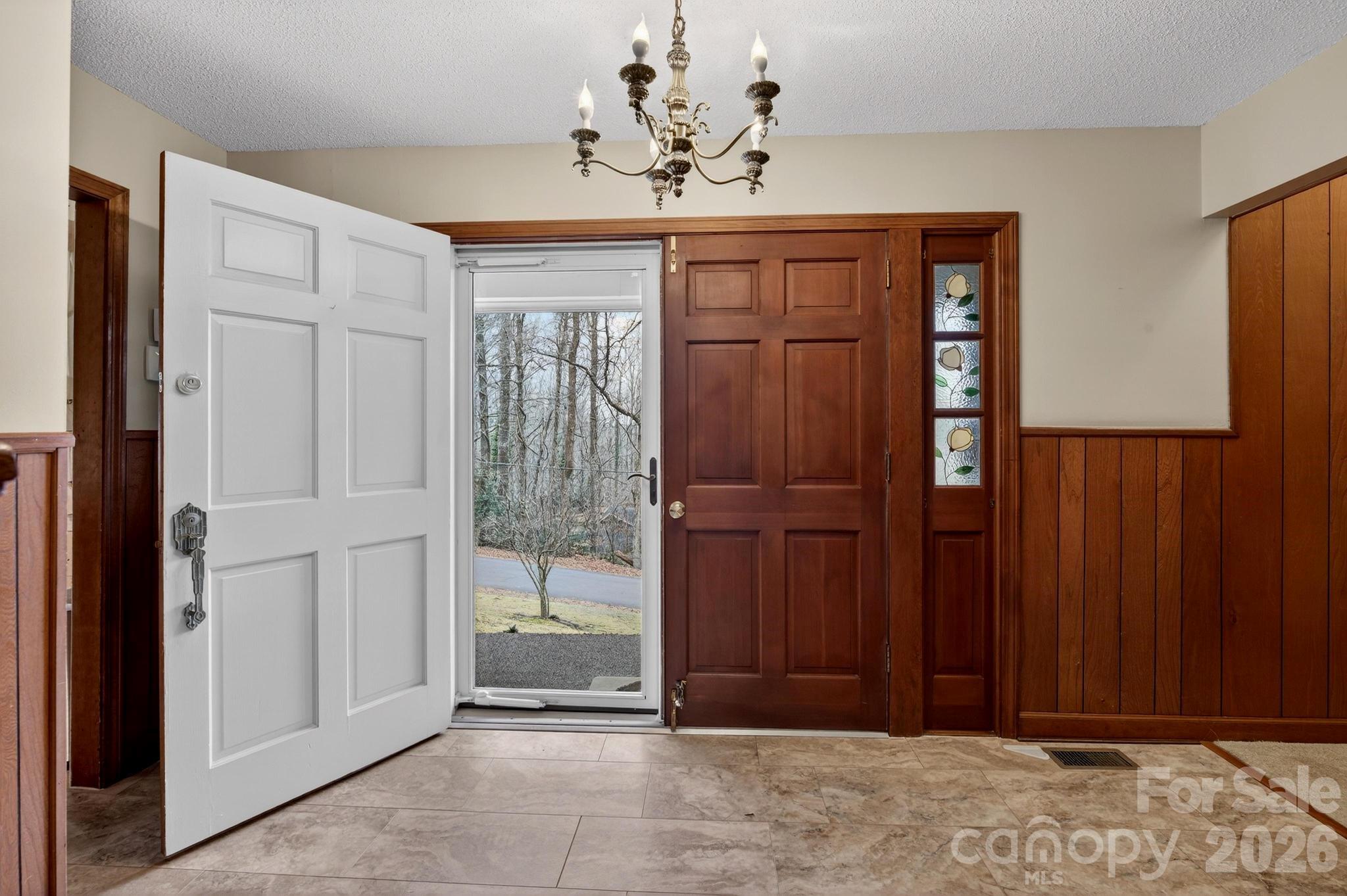 408 Spring Street Northwest Lenoir, NC 28645 - Photo 23 of 47 a view of a entryway with a chandelier
