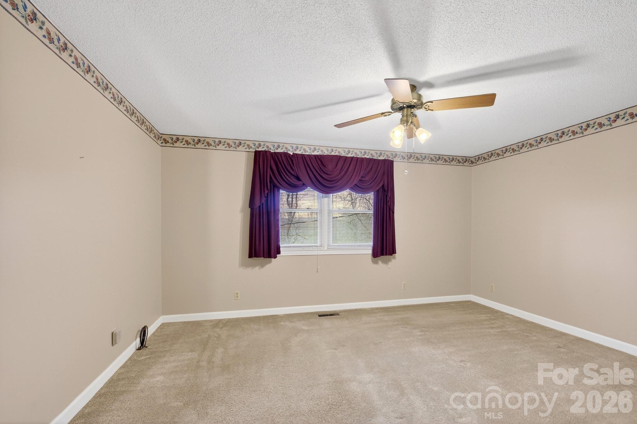 408 Spring Street Northwest Lenoir, NC 28645 - Photo 25 of 47 a view of an empty room with a window
